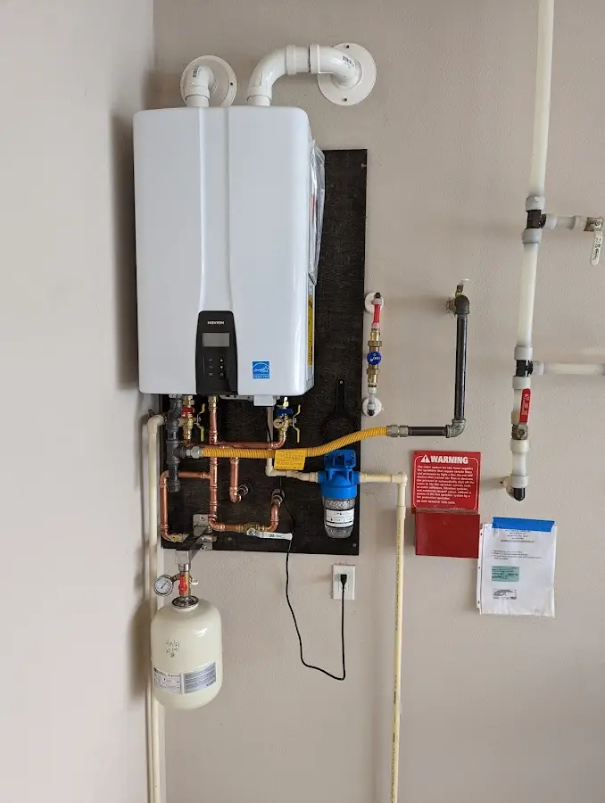 Professional plumber installing copper piping in a Upper Pottsgrove home